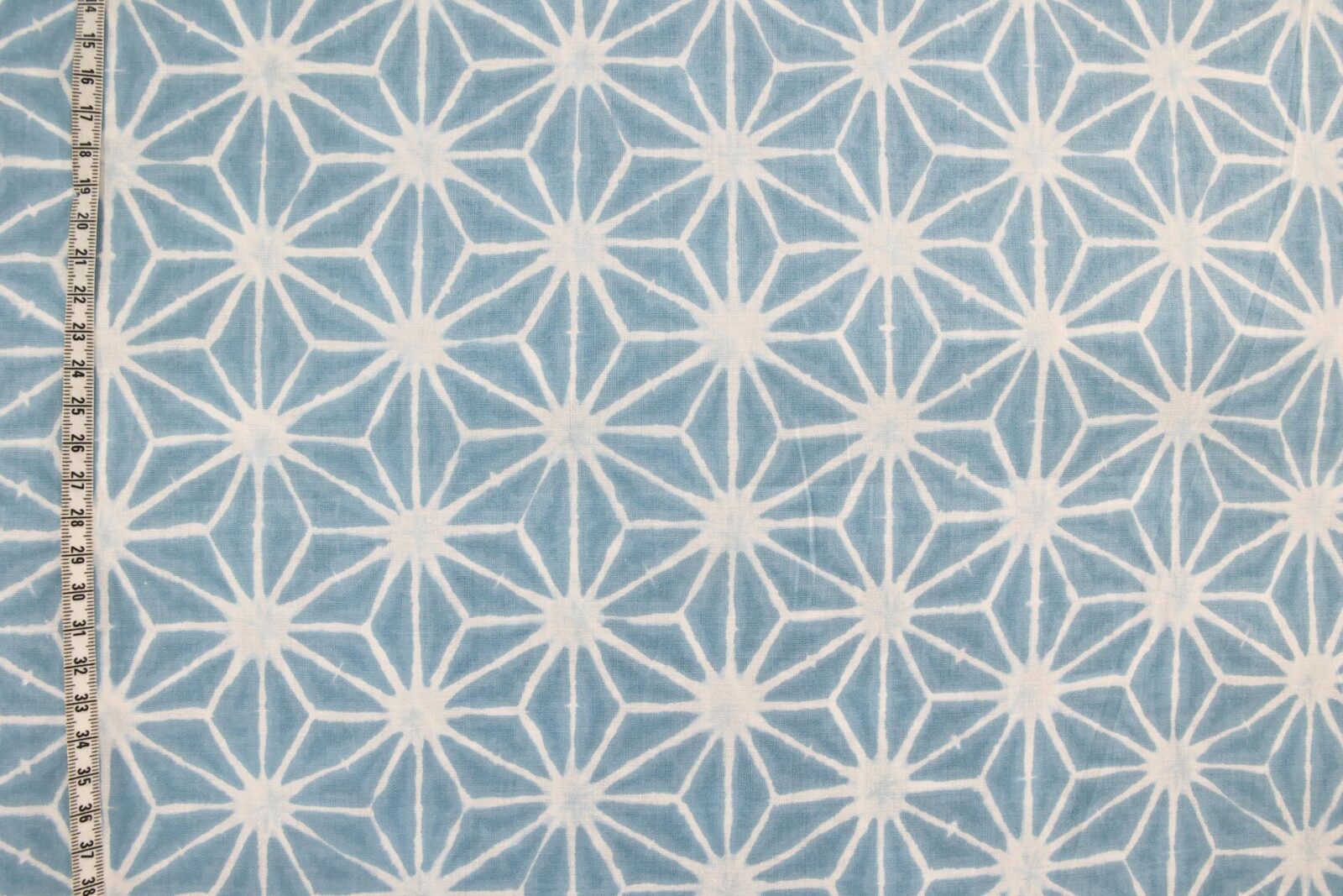 Asanoha Shibori white fabric blue background