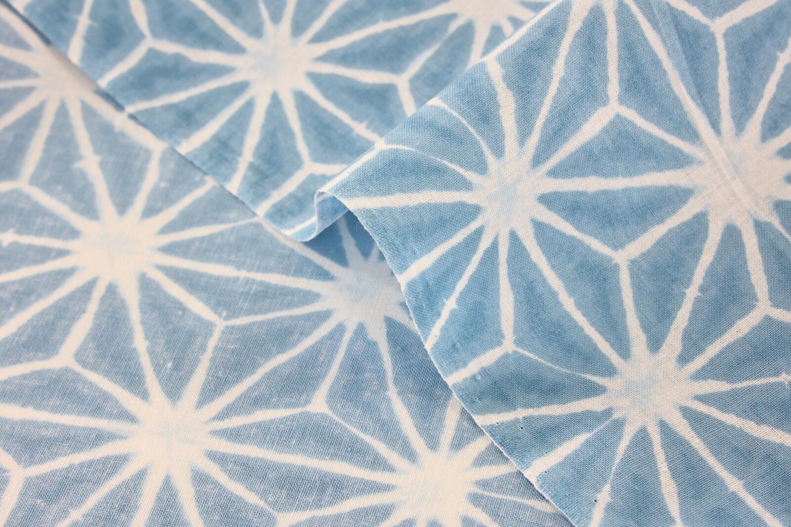 Asanoha Shibori white fabric blue background