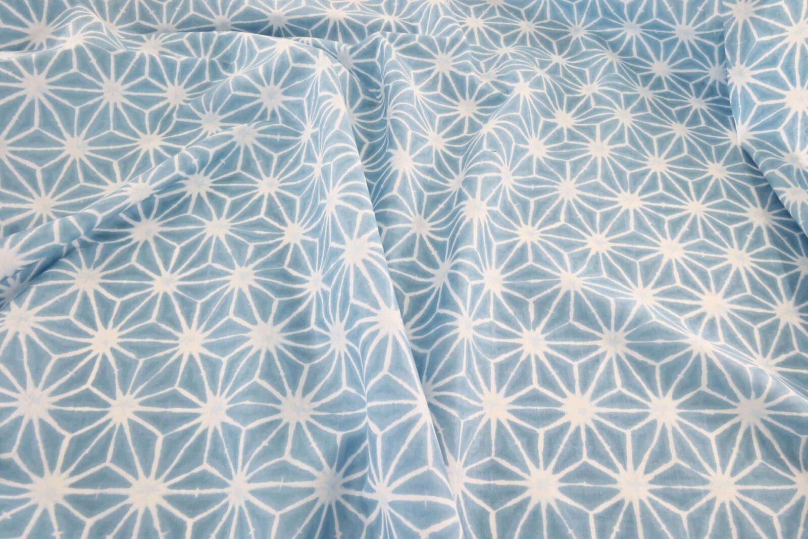 Asanoha Shibori white fabric blue background