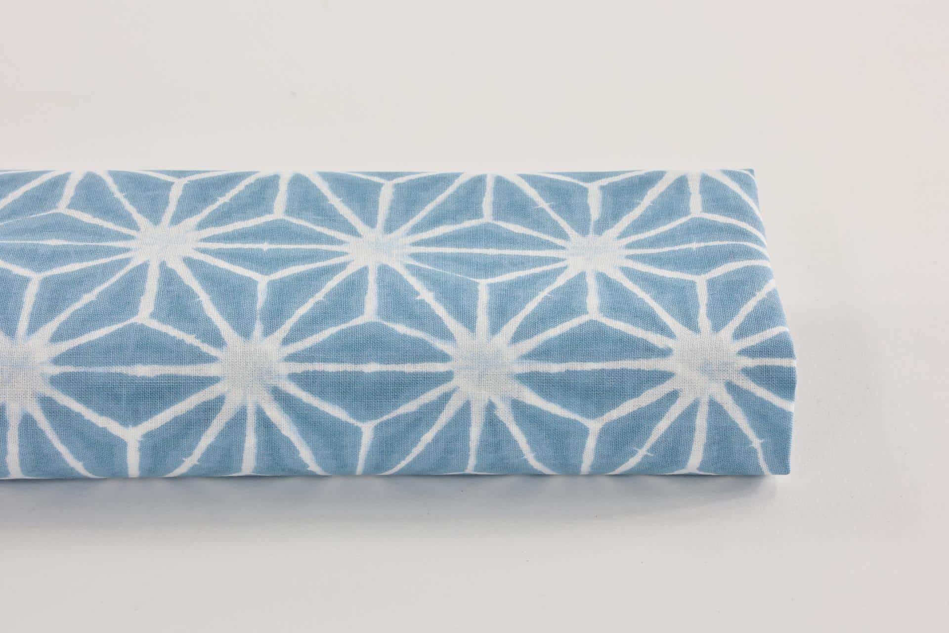 Asanoha Shibori white fabric blue background