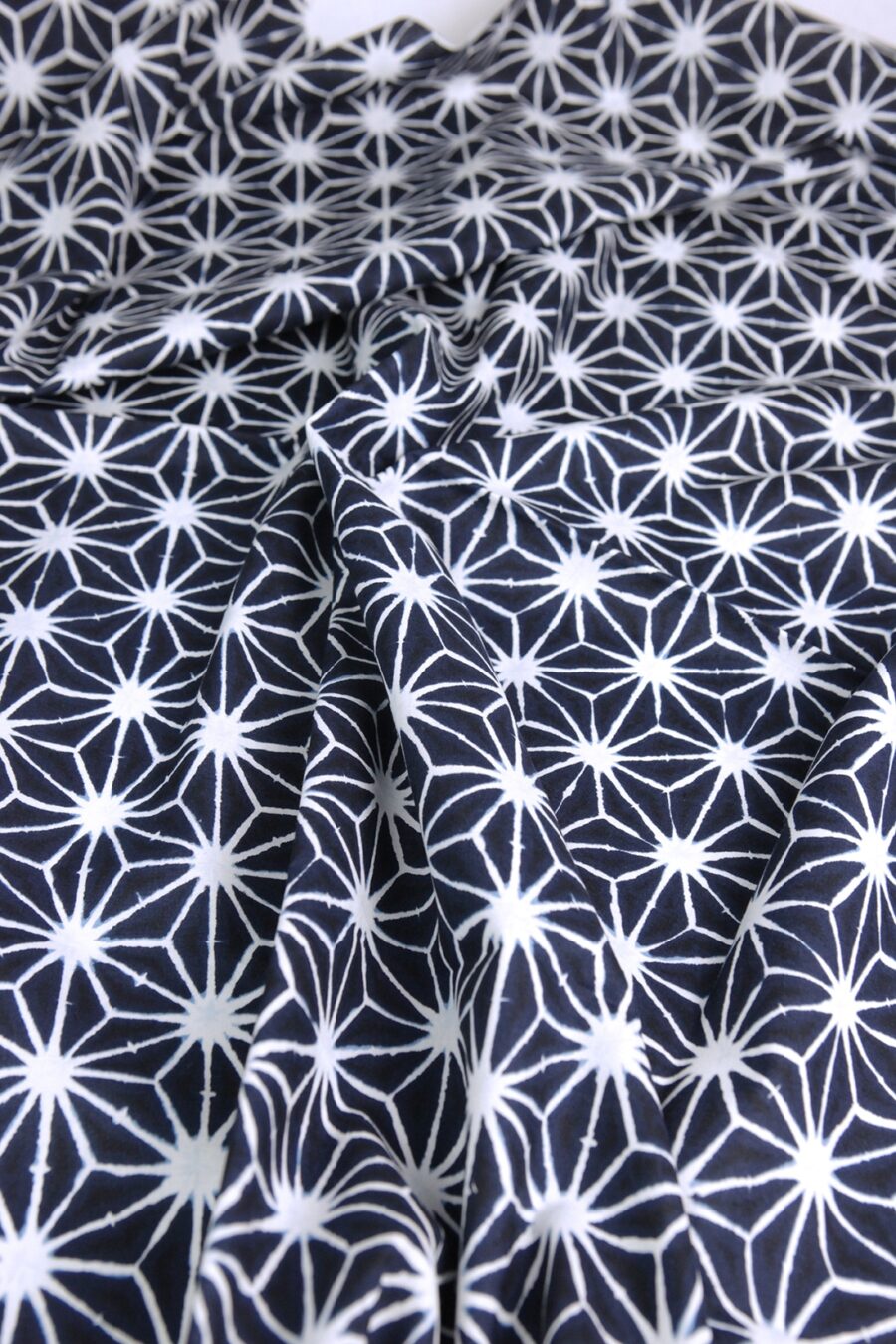 Asanoha Shibori indigo fabric blue background