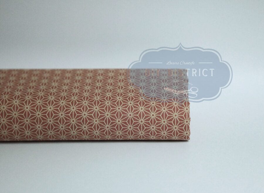 Japanese fabric Asanoha ecru on a pink background