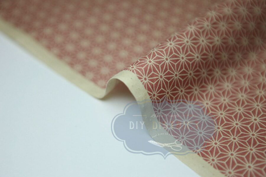 Japanese fabric Asanoha ecru on a pink background