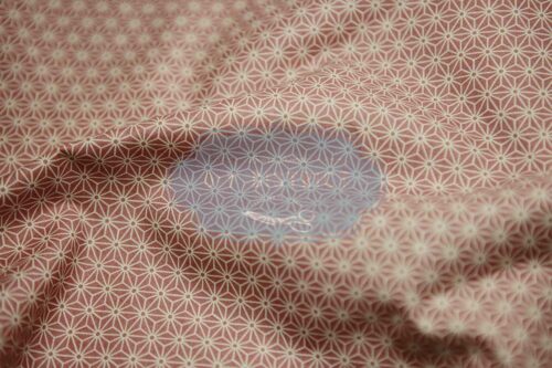 Japanese fabric Asanoha ecru on a pink background