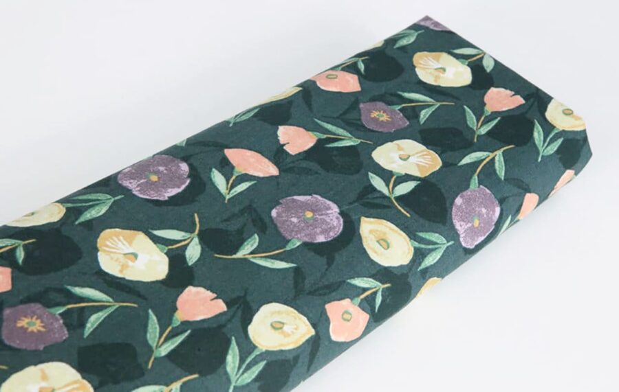 Liberty-style floral cotton lawn green background