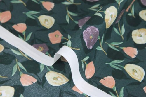 Liberty-style floral cotton lawn green background