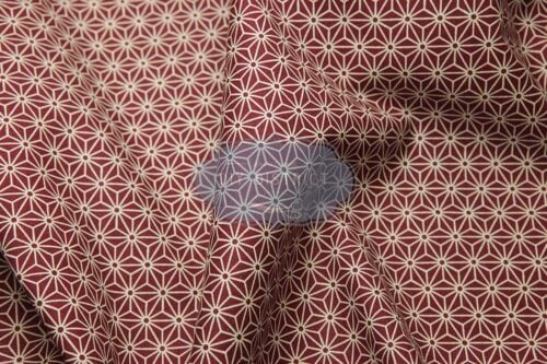Japanese fabric Asanoha ecru on a red background