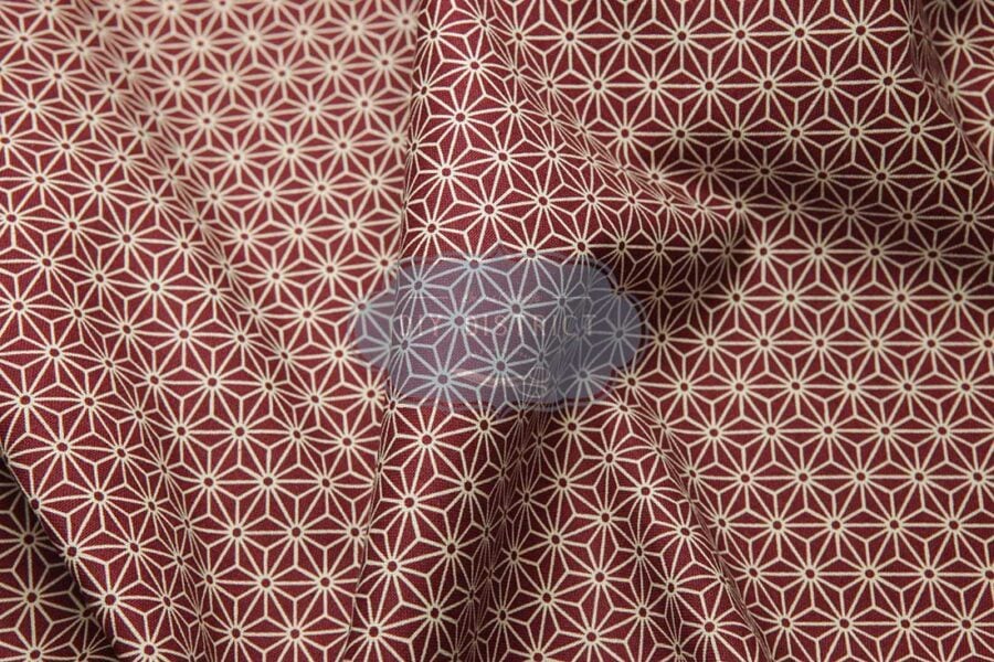Japanese fabric Asanoha ecru on a red background