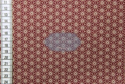 Japanese fabric Asanoha ecru on a red background