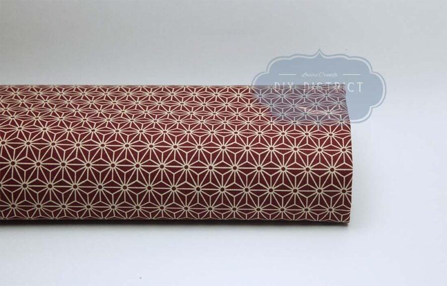 Japanese fabric Asanoha ecru on a red background