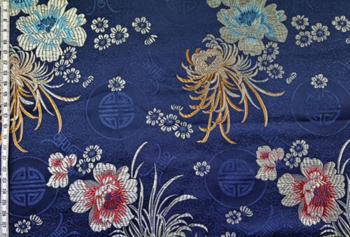Brocart jacquard bleu marine fleurie colorée. jacquard fabric