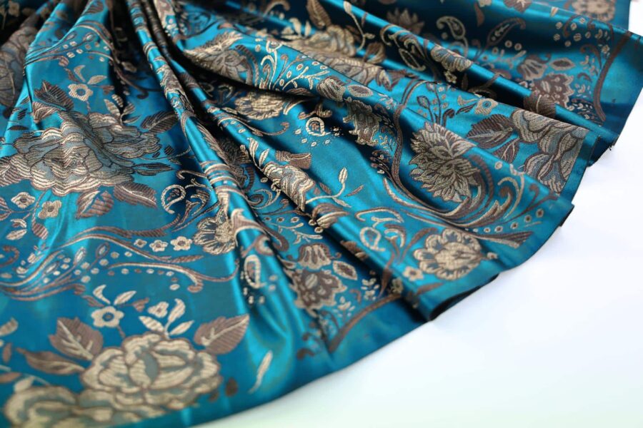 Tissu brocart fleur bronze fond bleu canard. Brocard fabric