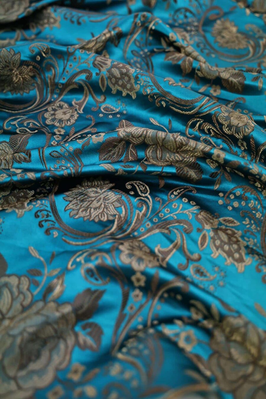 Tissu brocart fleur bronze fond bleu canard. Brocard fabric