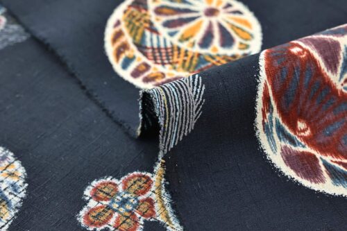 Japanese fabric Temari ball on navy blue background