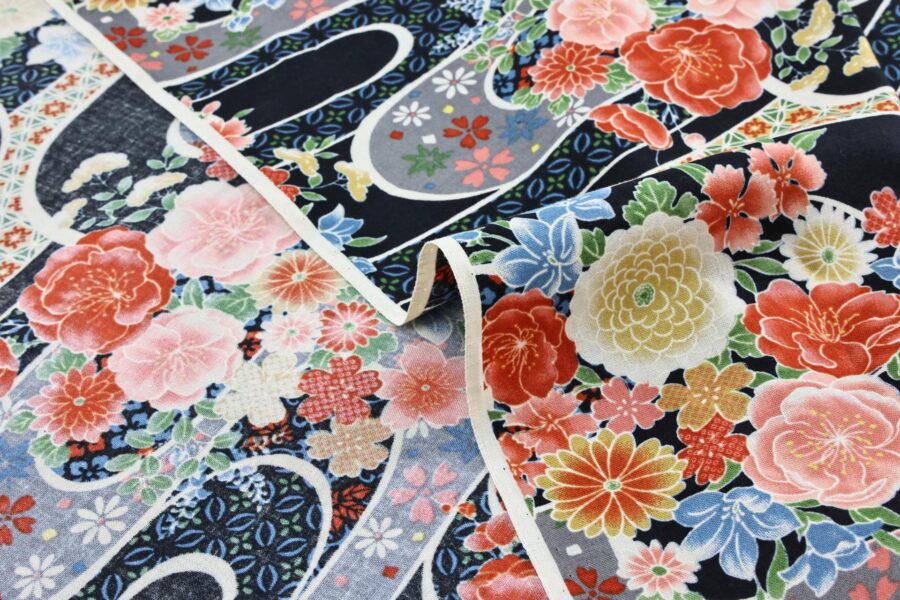 Japanese fabric with flower bouquet on water on black background