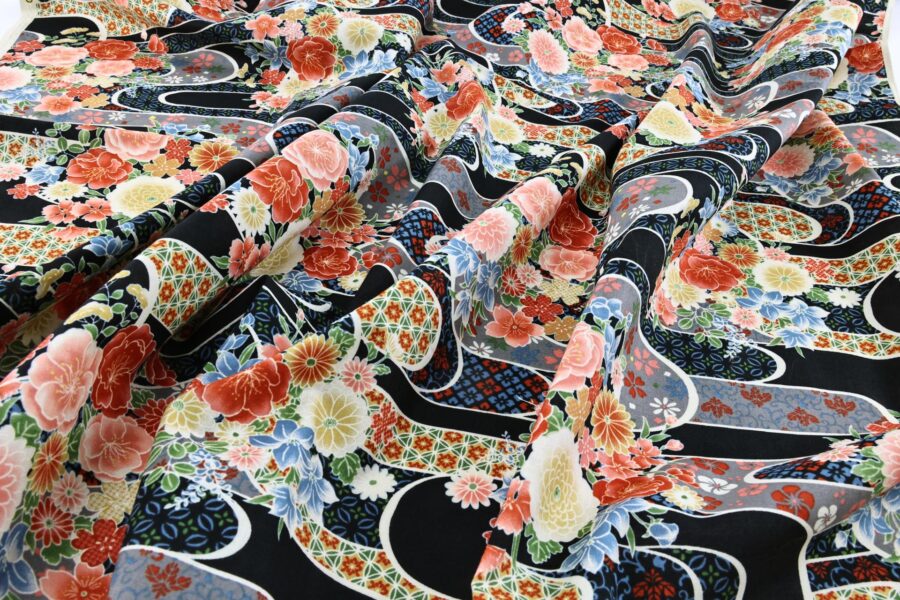 Japanese fabric with flower bouquet on water on black background