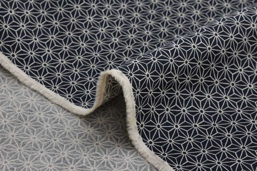 Japanese fabric Asanoha ecru on a blue grey background