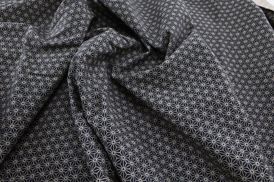 Japanese fabric Asanoha ecru on a blue grey background