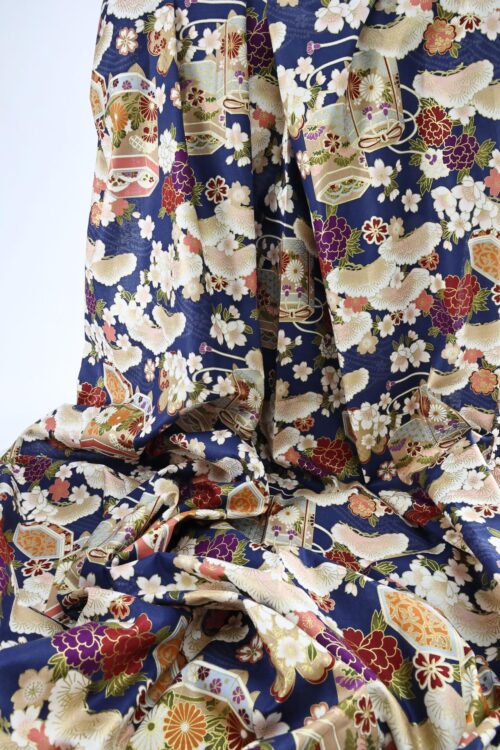 Japanese fabric Kaike with colorful flowers blue background