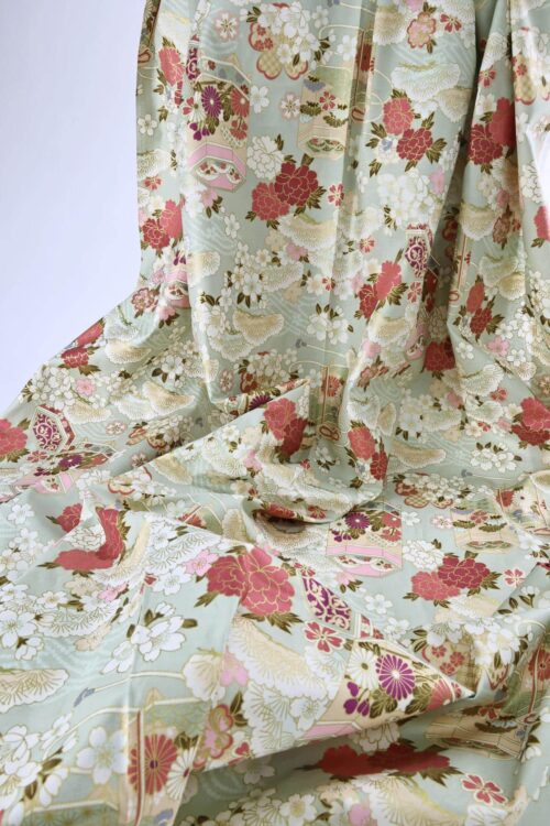 Japanese fabric Kaike with colorful flowers green background