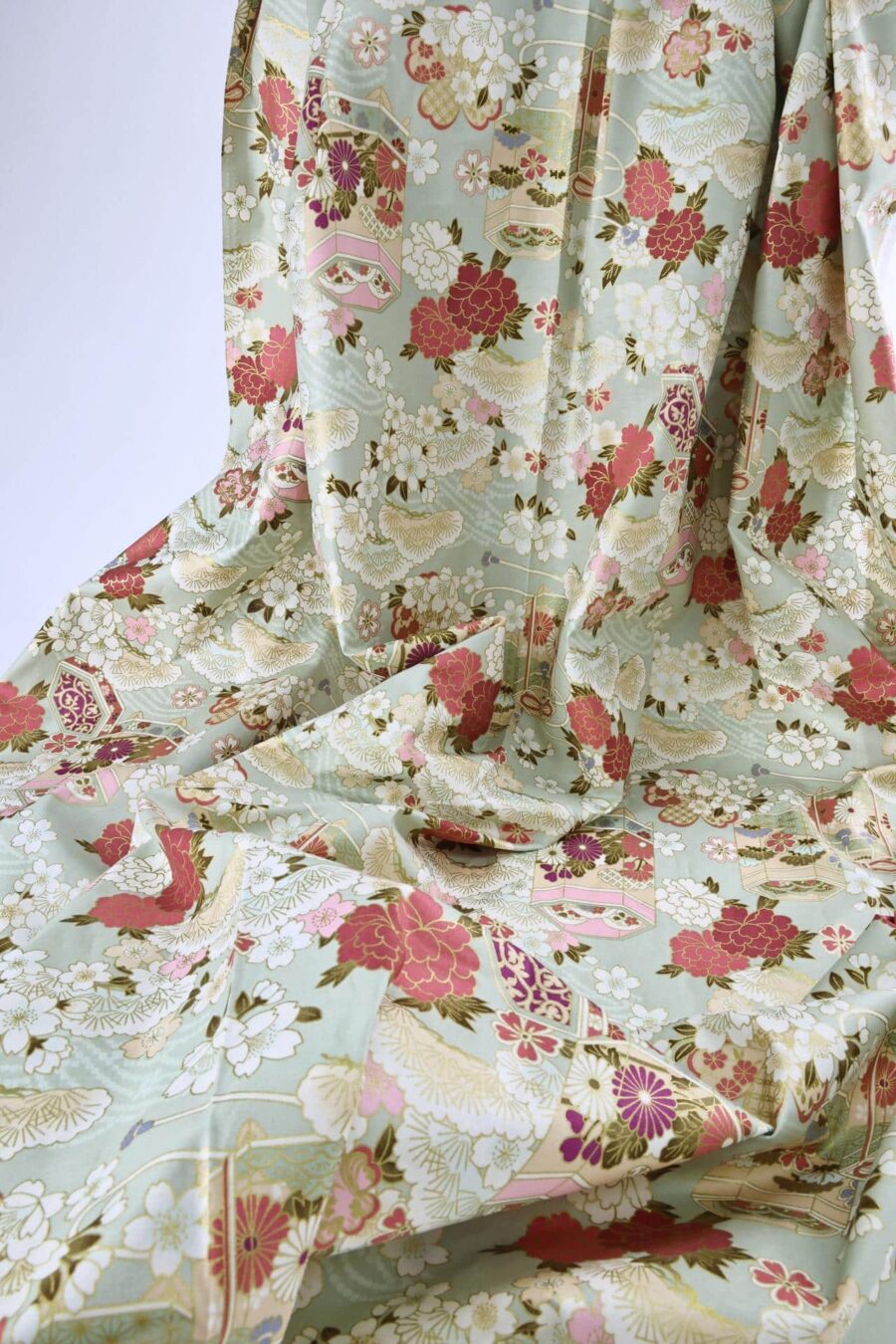 Japanese fabric Kaike with colorful flowers green background