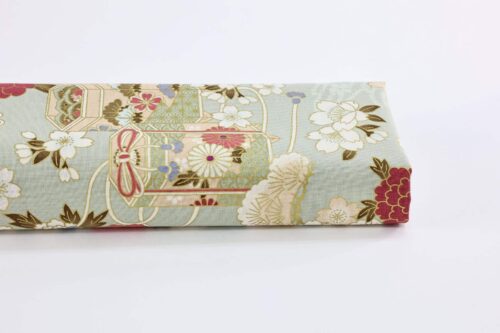 Japanese fabric Kaike with colorful flowers green background