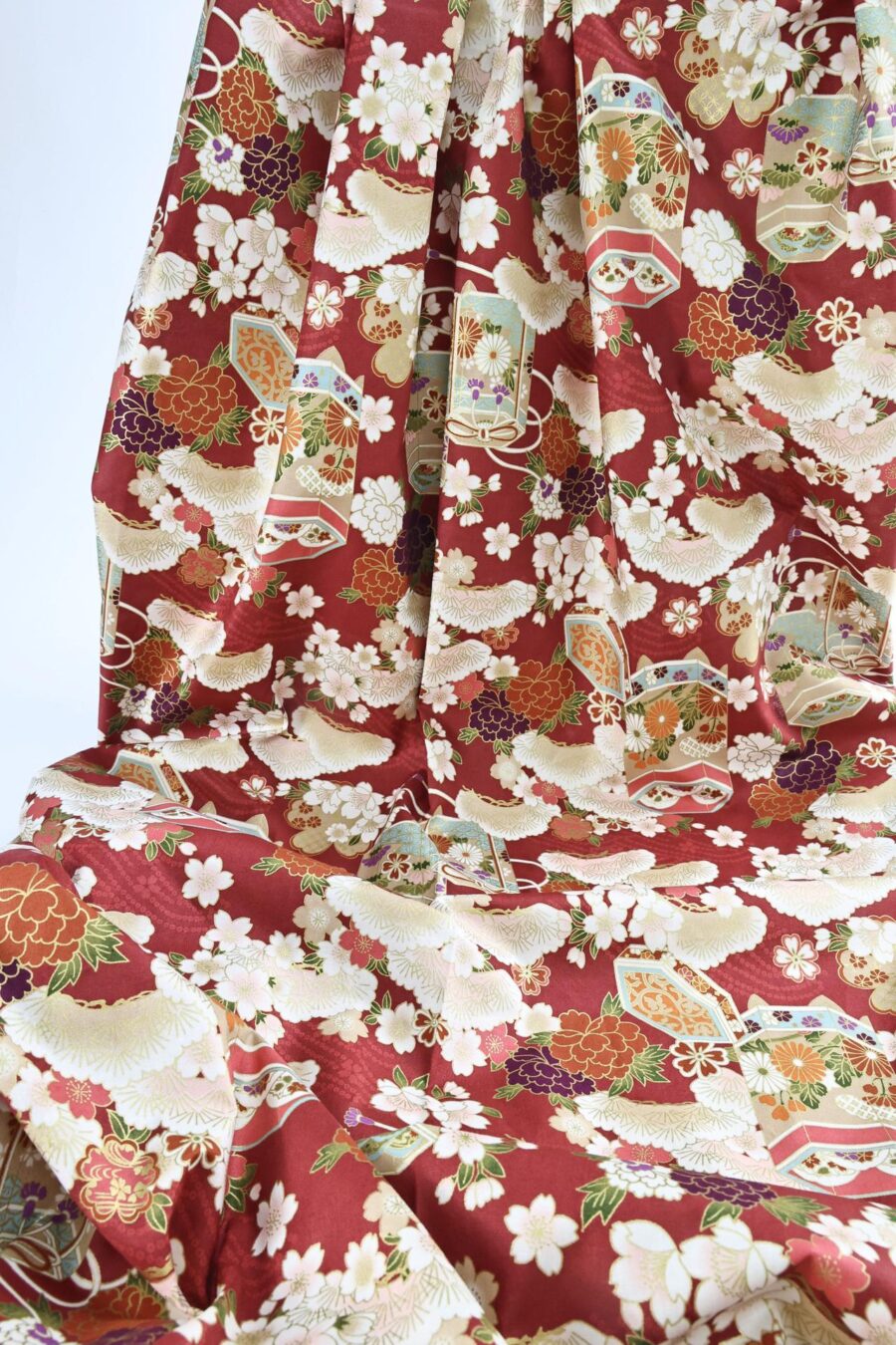 Japanese fabric Kaike with colorful flowers red background
