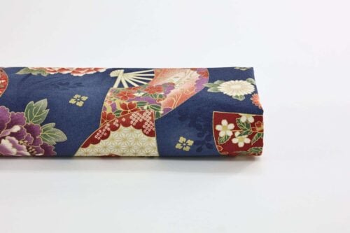 Japanese fabric fans and golden peonies on blue