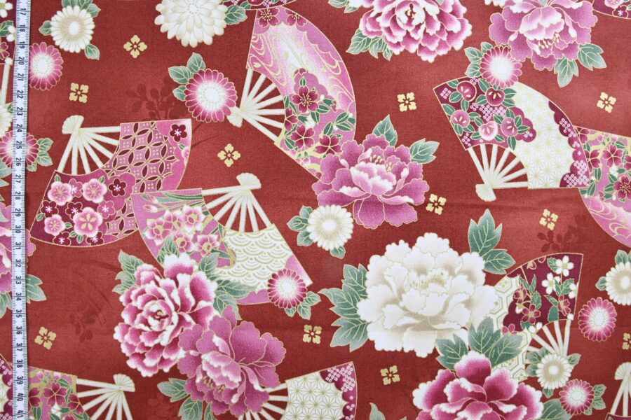 Japanese fabric fans and golden peonies on red