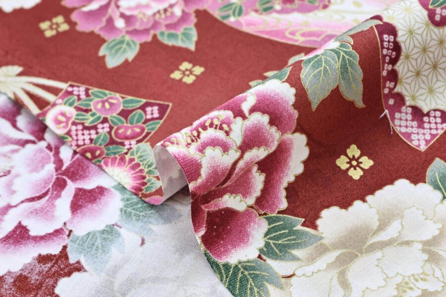 Japanese fabric fans and golden peonies on red