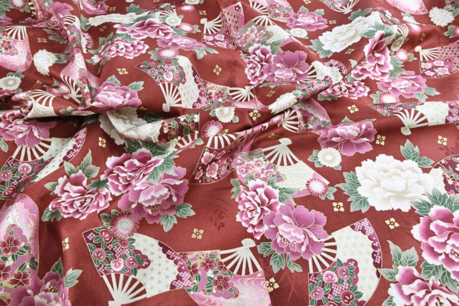 Japanese fabric fans and golden peonies on red
