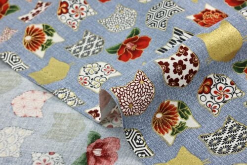 Japanese fabric with cat heads blue background