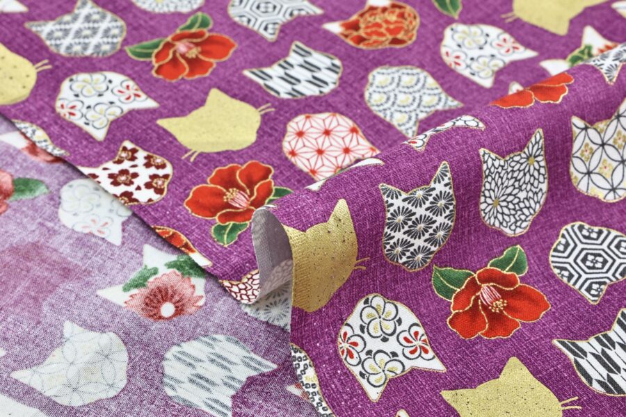 Japanese fabric with cat heads purple background