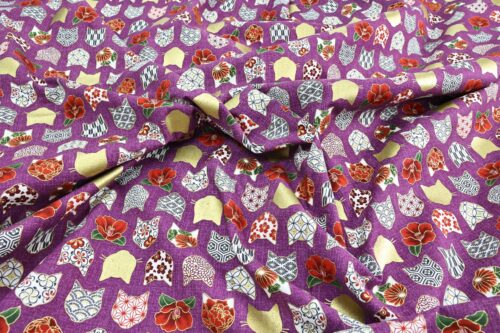 Japanese fabric with cat heads purple background