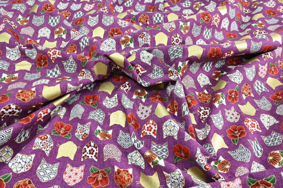 Japanese fabric with cat heads purple background