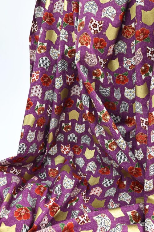 Japanese fabric with cat heads purple background