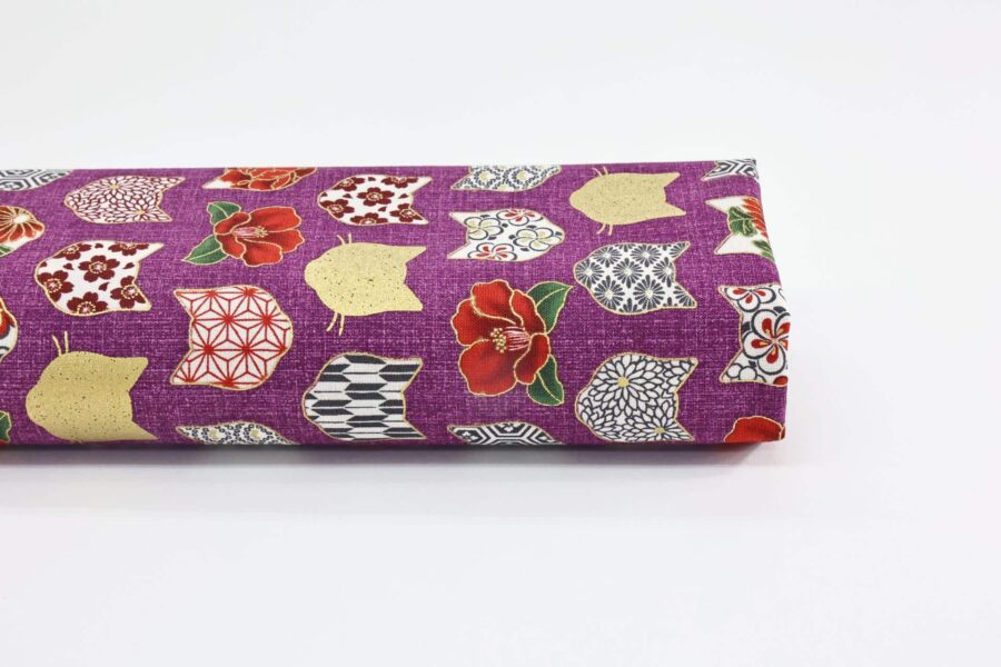 Japanese fabric with cat heads purple background