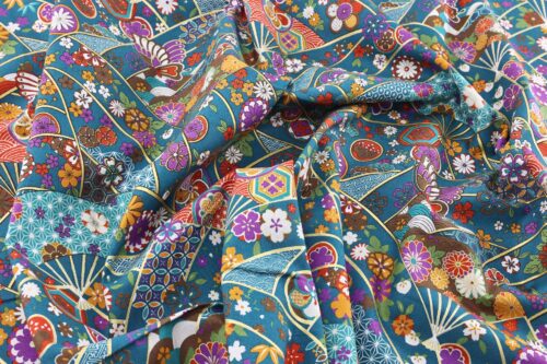 Japanese fabric butterfly Ougi and flowers on teal blue