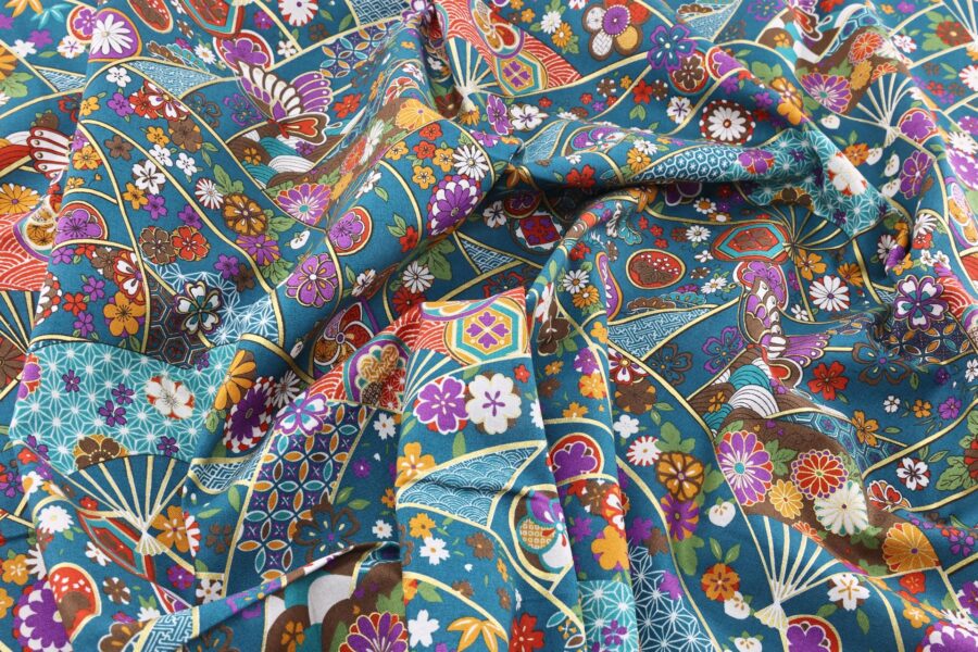 Japanese fabric butterfly Ougi and flowers on teal blue