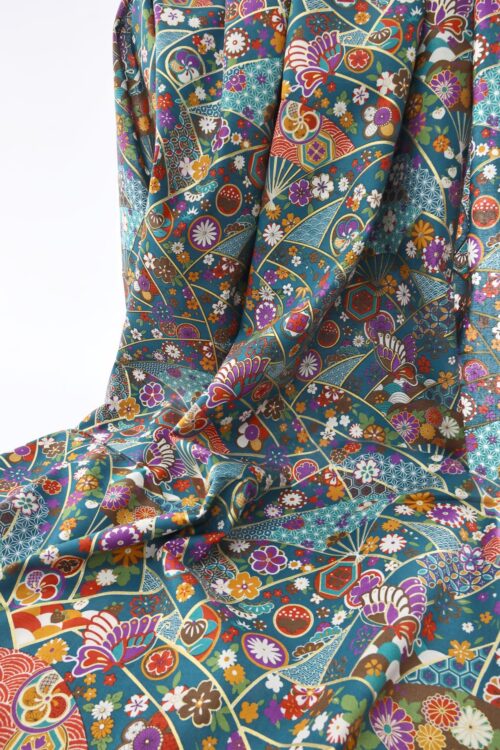 Japanese fabric butterfly Ougi and flowers on teal blue