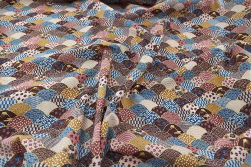 Fabric waves multi-patterned in blue, brown, and orange