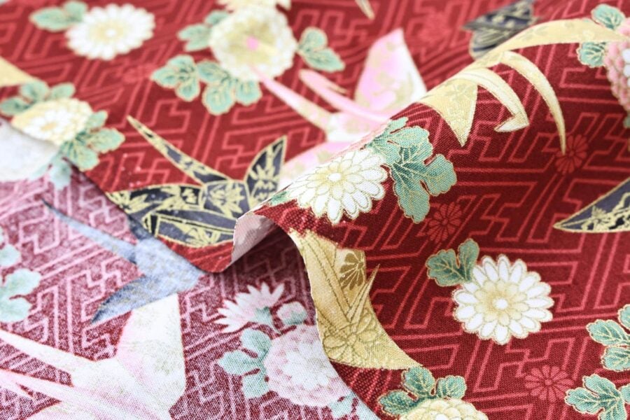 Japanese fabric origami cranes Sayagata red Background