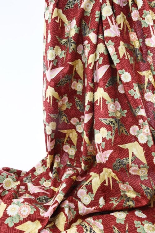 Japanese fabric origami cranes Sayagata red Background