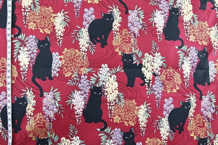 Black cat and Fuji flower fabric red background