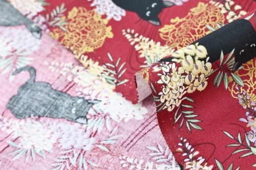 Black cat and Fuji flower fabric red background