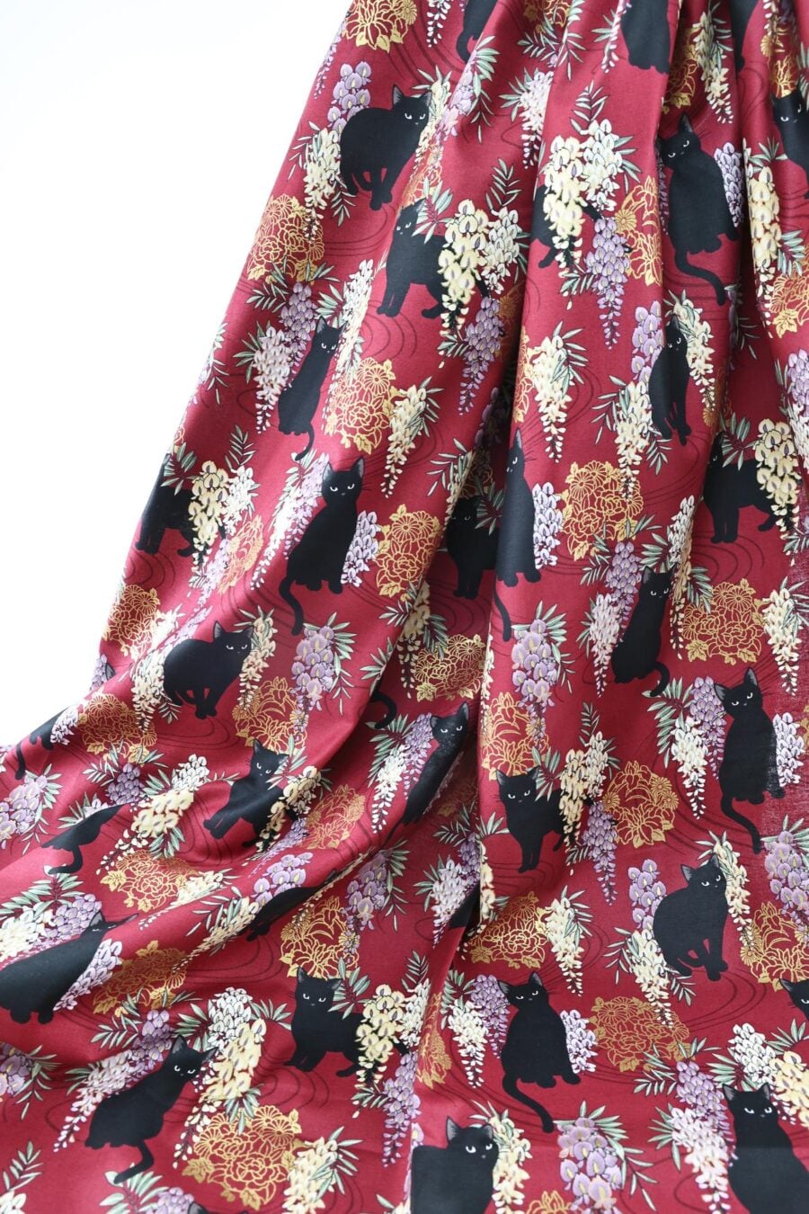 Black cat and Fuji flower fabric red background