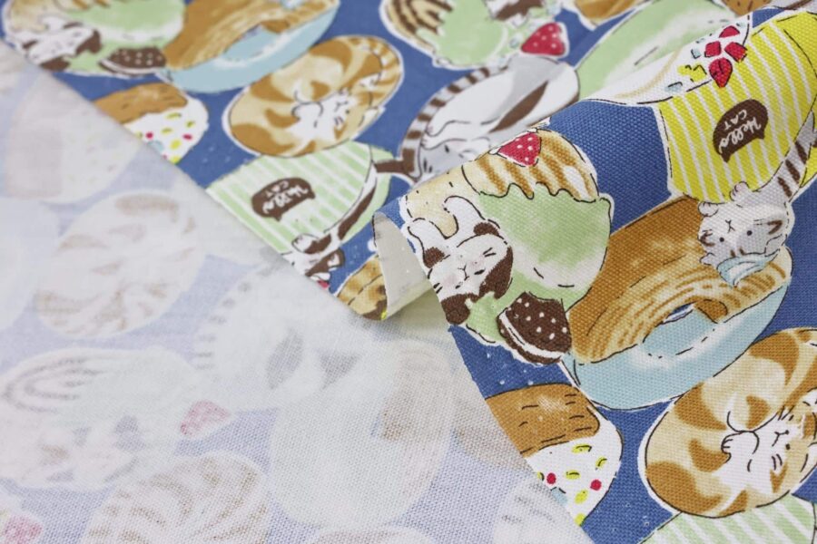 Oxford fabric cats pastries blue background