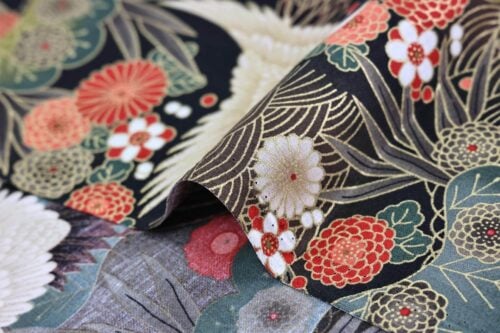 Japanese fabric cranes on golden river