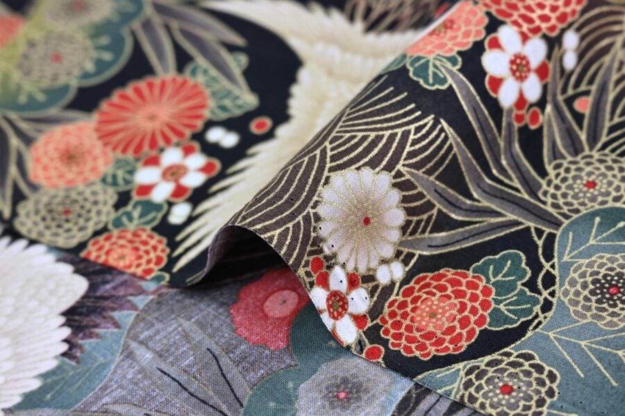 Japanese fabric cranes on golden river