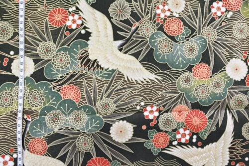 Japanese fabric cranes on golden river